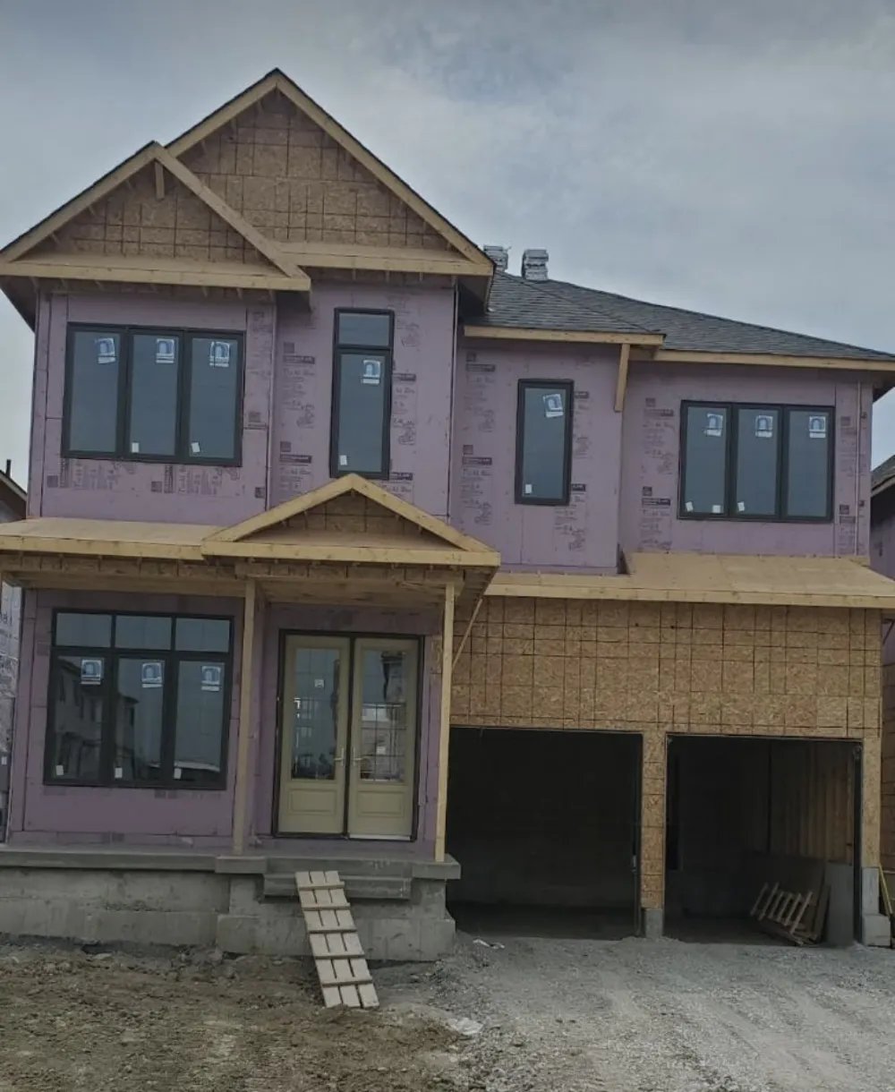 Two-storey new build framed and sheathed, insulation board installed